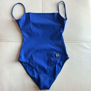 Brand new one piece, it has never been worn before. Beautiful soft blue material